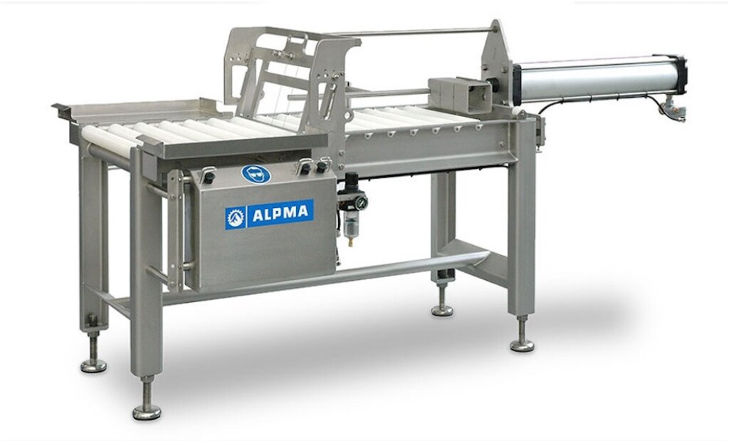 Stainless steel industrial cheese cutter (PT IV / Basic) featuring a roller conveyor and cutting mechanism for dividing cheese blocks into bars or portions.
