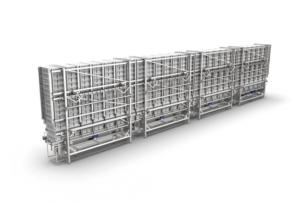 Storage area for empty containers in cheese production: stacked cheese molds in an automated storage system for the ripening of semi-hard cheese. Part of an industrial cheese production facility.